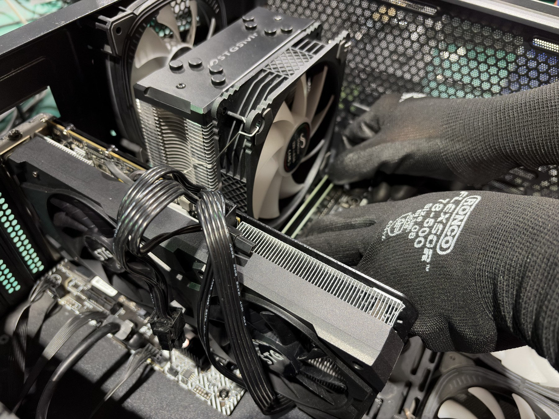 Technician working on a gaming desktop during assembly and hardware verification in Markham, Ontario